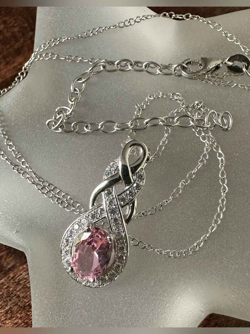 Sterling silver knotwork pendant with pink CZ stone and adjustable chain